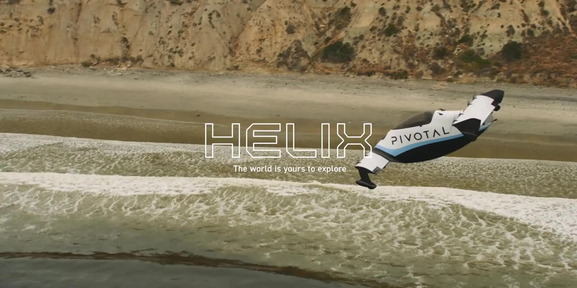 Pivotal Helix flying through scenic landscape with mountains and clouds in the background.